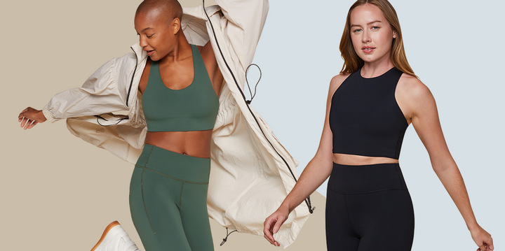 Two models are posing in front of a neutral background. The model on the left is in motion, wearing the Flex Convertible Sports Bra and Flex Leggings in Ivy, with a light jacket over her outfit. The model on the right is standing confidently, wearing the Flex Racerback Tank and Flex Bike Shorts in Black.